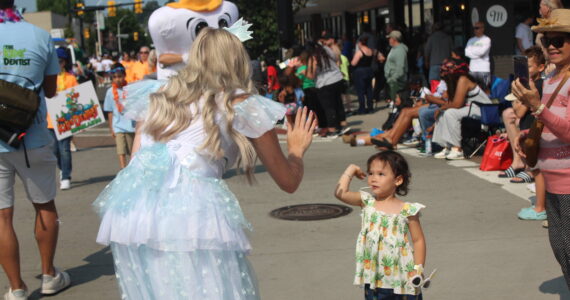 The tooth fairy gives a high five at the 2024 Renton River Days Parade. Photo by Bailey Jo Josie/Sound Publishing.