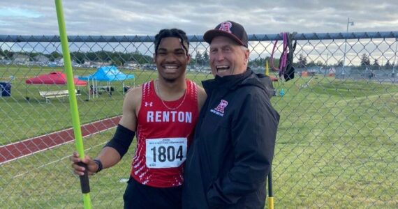 Demond Williams Jr. and Keith Eager after Williams won javelin at the state tournament. Courtesy photo.