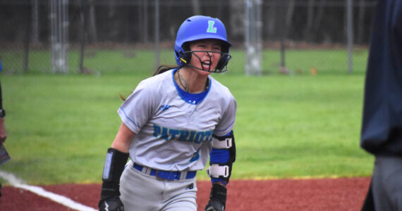 Kaila Siu gives a yell after hitting a two-run home run in the seventh inning. Ben Ray / The Reporter