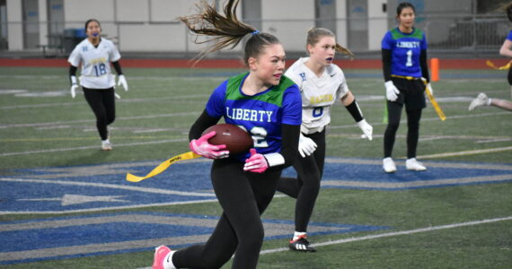 Ben Ray / The Reporter 
Alison Frank makes a catch and runs the ball upfield for Liberty High School.