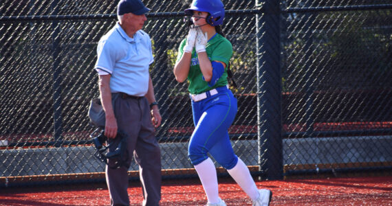 Emi Connell approaches home plate with a smile. Ben Ray / The Reporter