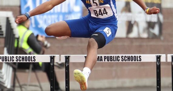 Kenyon Andrews leaps over hurdles at Mount Tahoma. Photo provided by Buddy Ryan.