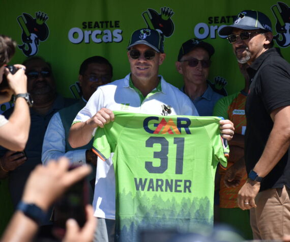 David Warner holds up his jersey for the Seattle Orcas. Ben Ray / The Reporter
