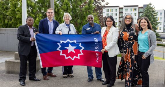 Renton City Councilmember Ed Prince, Mayor Armando Pavone, Councilmembers Valerie O'Halloran, Kim-Khánh Văn, Ruth Pérez and Carmen Rivera hold up the Juneteenth flag at the city's inaugural Juneteenth flag raising on Wednesday, June 18. Courtesy photo.